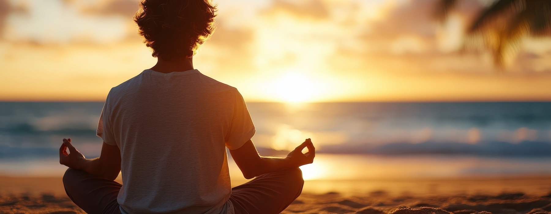 a man sitting on a beach